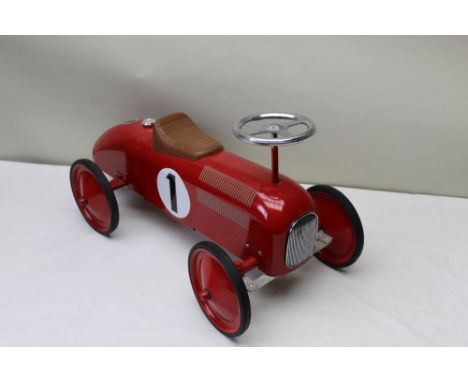 A red finished Bugatti style, child's ride on sports car, approx 72cm long 