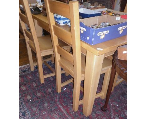 Modern light wood kitchen table and set of four matching chairs