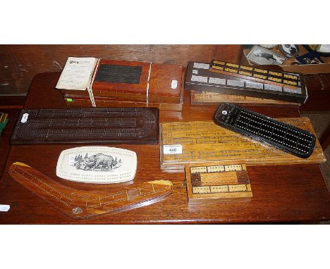 Nine vintage assorted cribbage boards, inc. a 'boomerang" cribbage board, a bakelite example, a pearlite one and others, toge