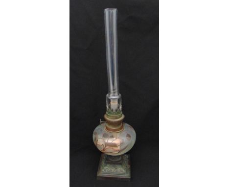 A 19th century oil lamp with painted glass oil well, clear glass funnel on raised square metal base, 52cm (h)