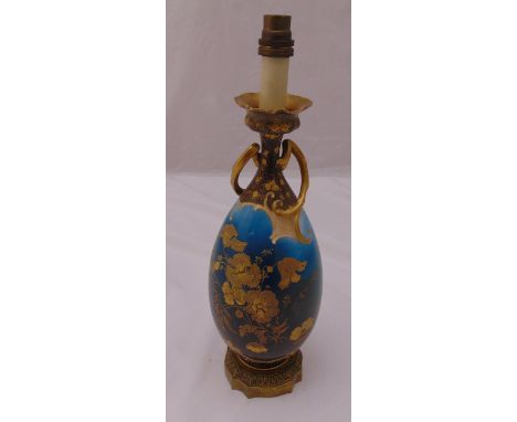 A late 19th century ceramic lamp base decorated with flowers and leaves on raised ormolu base, 42cm (h)