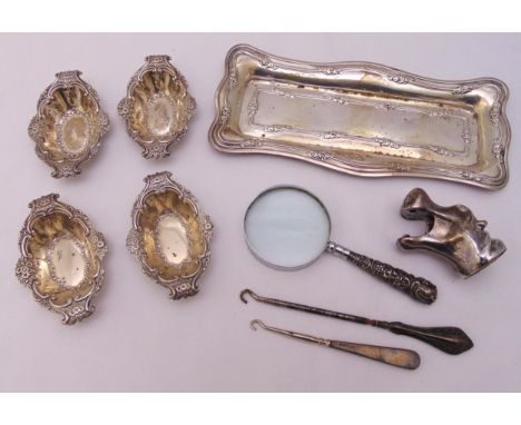 A quantity of hallmarked silver and white metal to include a bonbon dish, a rectangular dressing table tray, button hooks, a 