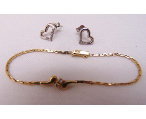 A 9ct yellow gold and diamond bracelet and a pair of 9ct white gold and diamond heart shaped earrings, approx total weight 4.