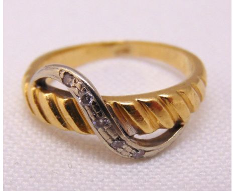 Gold and diamond crossover ring, tested 14ct, approx total weight 3.2g