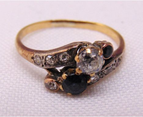 Gold diamond and sapphire crossover ring, tested 9ct, approx total weight 2.2g