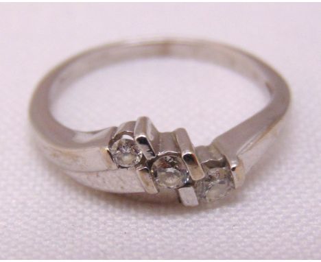 9ct white gold three stone diamond crossover ring, approx total weight 2.1g