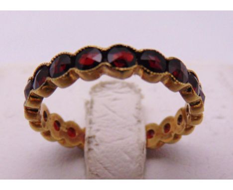 14ct yellow gold and garnet eternity ring, approx total weight 2.1g
