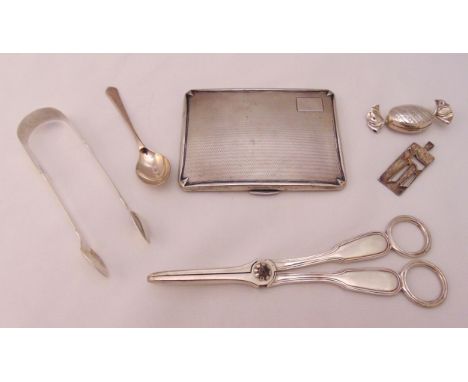 A quantity of hallmarked silver and white metal to include a pair of grape scissors, an engine turned cigarette case, a pair 