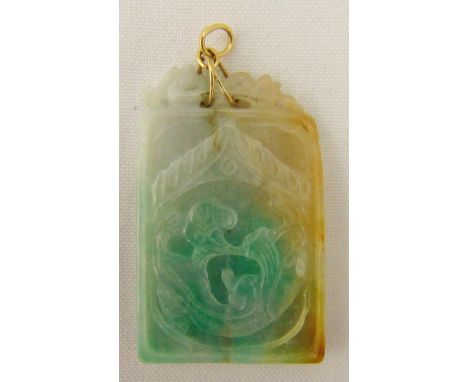 A carved rectangular jade pendant
