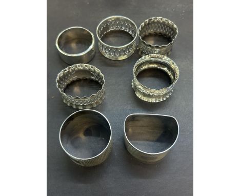 6x Silver hallmarked napkin rings & 1 white metal Total weight 144g