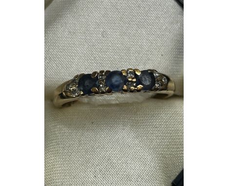 9ct Gold diamond & sapphire ring in box Size P.5 