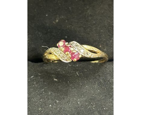 Gold ring set with diamond & ruby (Hallmarked rubbed, possibly 18ct gold) Size P Weight 1.5g