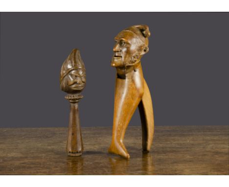 A carved wooden grotesque head nutcracker,  with screw-action handle —7in. (17.5cm.) high (chip to top of hat); and a French 