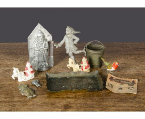 Christmas items, a small brass tray embossed with a scene of Father Christmas visiting children playing —5½in. (14cm.) wide; 