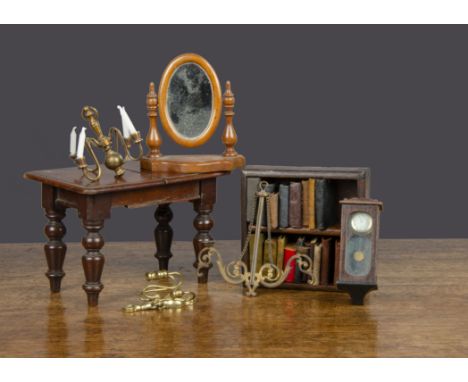 Dolls’ house furniture, a mahogany extendable table with turned legs —5¾in. (14.5cm.) long (missing leaf); a German wall cloc