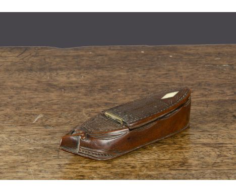 An early 19th Century carved wooden slipper snuff box, with intricately-carved top, heart-shaped motif to toe, hinged lid wit