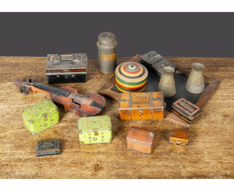 Tinplate trunks, a Fry’s Chocolate trunk —4¼in. (10.5cm.) wide; another with Rothwell Golborne luggage label and two green tr