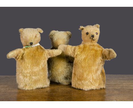 Three British teddy bear glove puppets, all probably by Omega, one with reddish gold mohair, orange and black glass eyes, bla