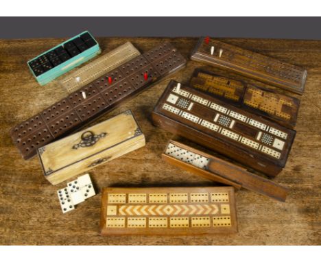 Dominios and cribbage,  a cream painted wooden box with steel mounts containing bone dominos —8¼in. (21cm.) long; a mahogany 
