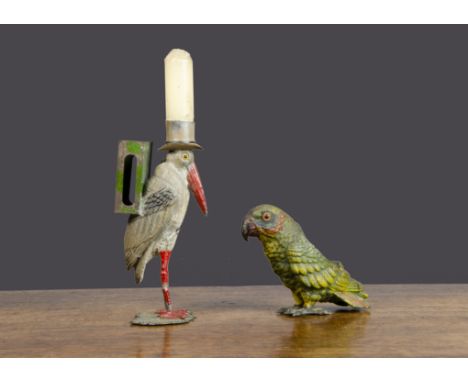 A German lead parrot pen wipe,  painted mainly green, standing on feet —3¾in. (9.5cm.) high (missing bristles); and a marabou