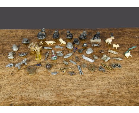 Cracker charms and miniatures, a penknife, thimble and scissors attached to a ring; a Touch Wood charm (legs need re-attachin