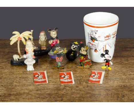 Disney items, two two-dimensional lithographed tinplate Mickey Mice —2¼in. (5.5cm.) high, a celluloid Mickey on roly-poly bas