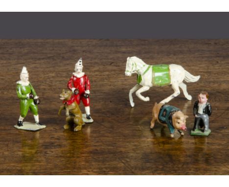 Circus items by Britains and others, including a rare John Hill pig in jacket, Britains tub and two boxing clowns, Charbens e