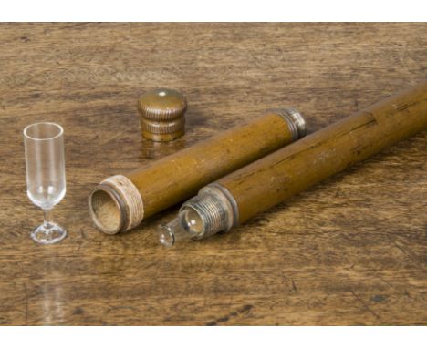 A 19th Century flask and glass Malacca walking stick, with two unscrewable compartments hiding a glass flask and the copper k