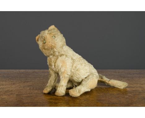 An early Steiff six-way jointed cat,  with white mohair, green and black glass eyes with a black edge, pink stitched nose, mo