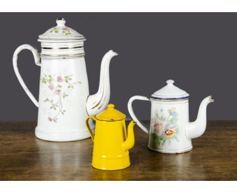 Three enamel coffee pots,  the largest Austrian with percolator and floral transfer decoration —9¾in. (25cm.) high; a smaller