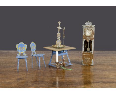 German soft metal dolls’ house items, two blue painted chairs —3in. (7.5cm.) high and matching table with wooden top; a brown