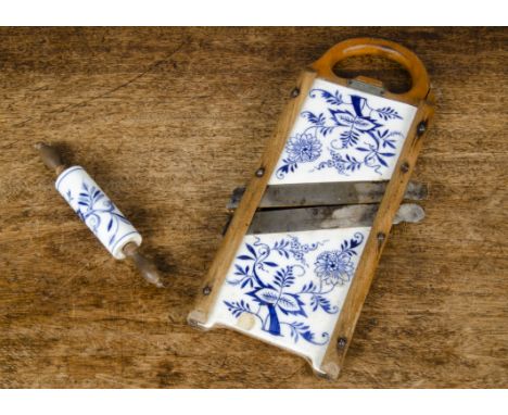 A Meissen Flow Blue Mandolin food slicer,  with blue painted porcelain panels on wooden frame, brass plaque ‘GESETZLICH GESCH