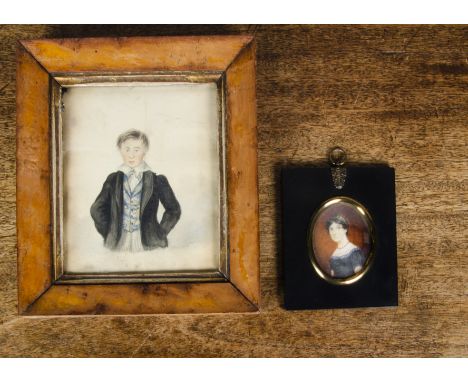 An English School watercolour portrait of a boy,  in tail coat with fancy waistcoat, in bird's-eye maple frame —9½in. (24cm.)