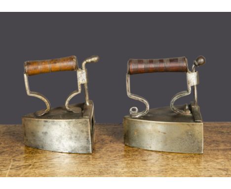 A 19th Century British Kendrick &amp; Co iron box iron,  with turned wooden handle and maker’s stamp on gate —4¼in. (11cm.) l