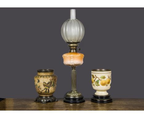 A brass and orange glass oil lamp,  with moulded orange glass well, on brass column with acid etched and cut glass shade —28i