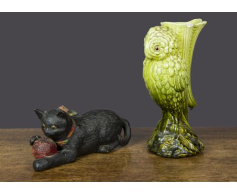 An English pottery green-glazed owl vase,  with glass eyes with registered no.367028 —11¼in. (28.5cm.) high (chip); and a Bre