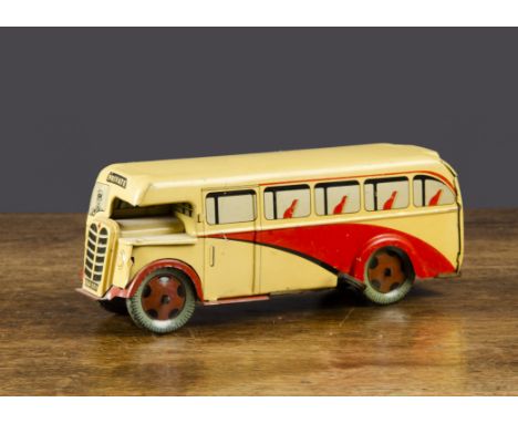 A Wells Brimtoy cream and red single deck bus, clockwork, cream and red lithographed tinplate with silver windows and CLX 553