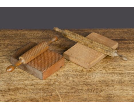 Two crimping boards with rollers, one a good match with turned handles —7in. (17.5cm.) length of roller; and another block wi