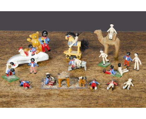 A quantity of lead Golliwogs and Dutch dolls, mainly modern, including a vignette of a domino game on a carpet —3in. (7.5cm.)