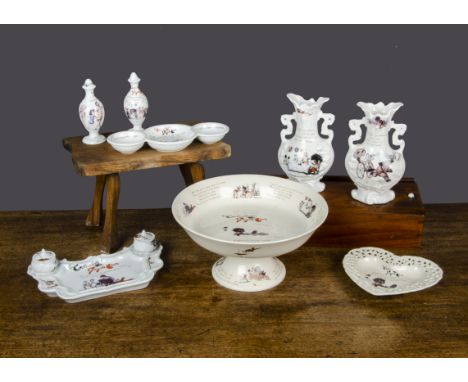 A quantity of modern porcelain decorated with Florence K Upton Golliwogg images,  Including a large fruit bowl on stand —11¾i