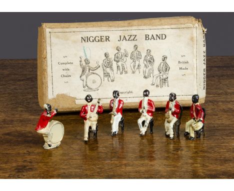 A Taylor &amp; Barrett six-piece 'N****r Jazz Band',  complete with five chairs and one incorrect chair, in original box (G-V