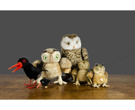 Post-war Steiff owls and crows, a dralon owl with button and yellow tag —12in. (30.5cm.) high; three Wittie owls (one worn); 