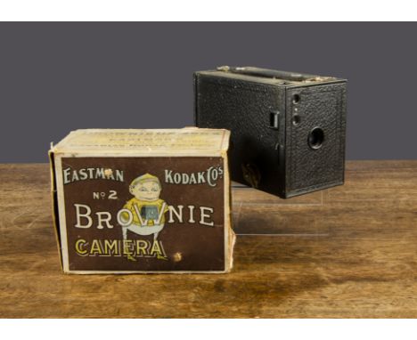 An Eastman Kodak Co Brownie Camera No 2,  in original box illustrated with a Brownie —5¾in. (14.5cm.) long (box missing half 
