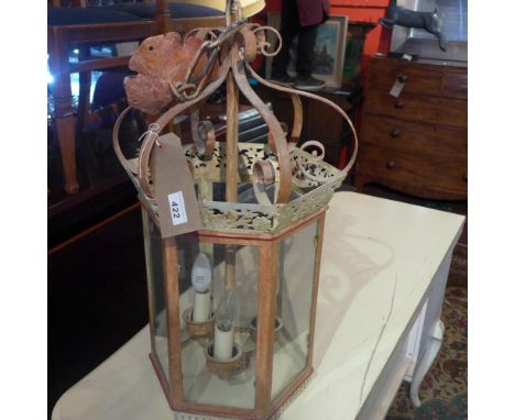 A painted and distressed metal hanging lantern 