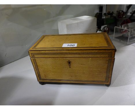A Georgian satinwood and inlaid tea caddy 