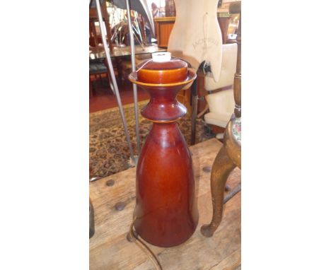 An Anthony Gilham Rohan pottery table lamp, glazed in deep red 