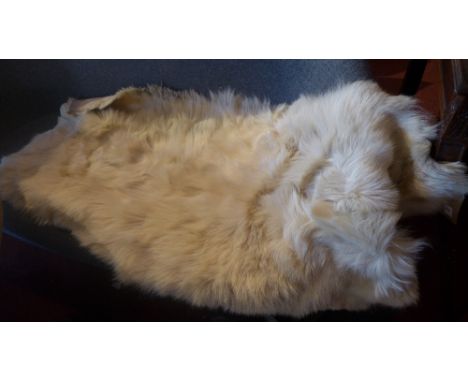 A vintage c1970's goat skin rug 