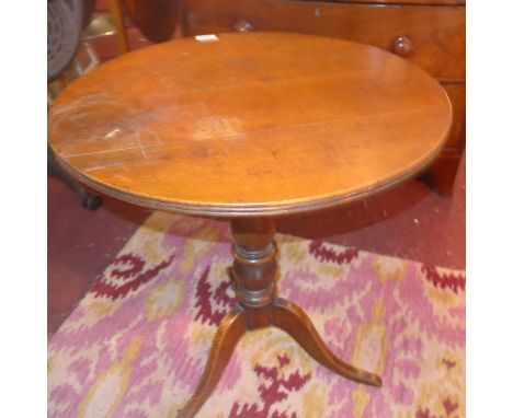 A 19th century oak tilt top tripod table