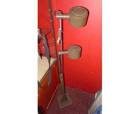 A vintage floor standing reading lamp in hues of brown 