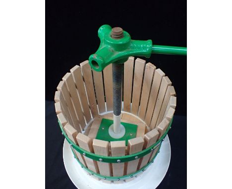 AN APPLE/CIDER PRESS, ENAMELLED STEEL BASEwith wooden metal-bound top and iron screw 37cm wide (unused, light rust to edge fr